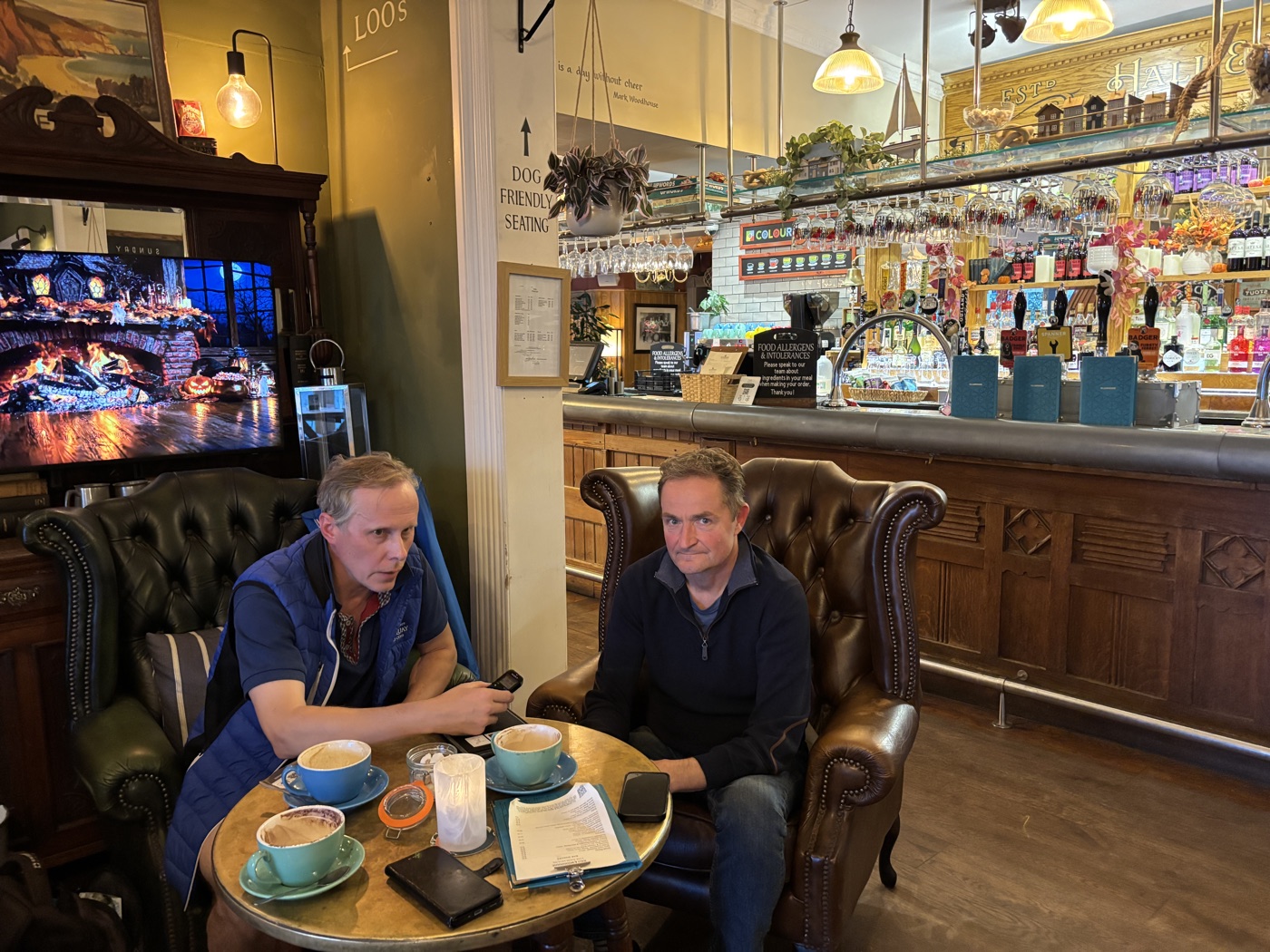 Leo and Heikki during the interview in The Ness, with a voice recorder and coffee cups on the table